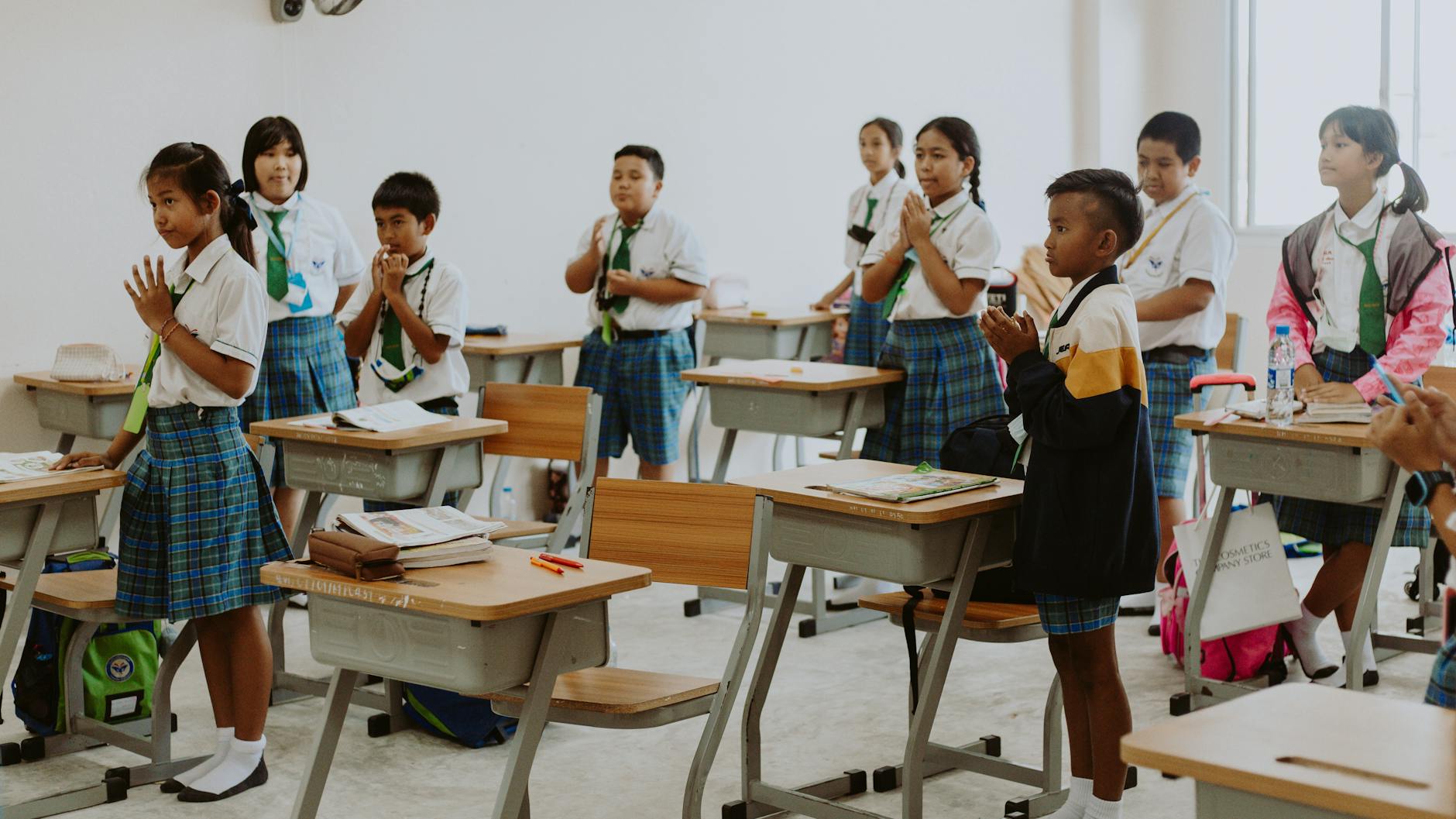 children in school uniforms in classroom
